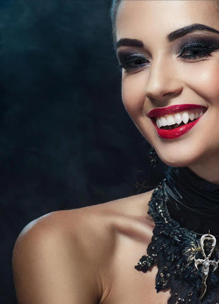 Ester is wearing Brooklyn Doubles 3D Fangs by Sabretooth Fangs and a 3rd Generation Legacy Ankh in Sterling Silver with White Moonstone. Makeup by JoHanna Moresco.