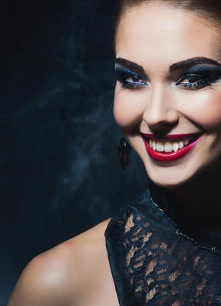 Ester is wearing Lost Boys fangs and a Third Generation Legacy Ankh in Rhodium Protected  Sterling Silver with Garnet Gem. Makeup by Jo-Anna  Moresco.